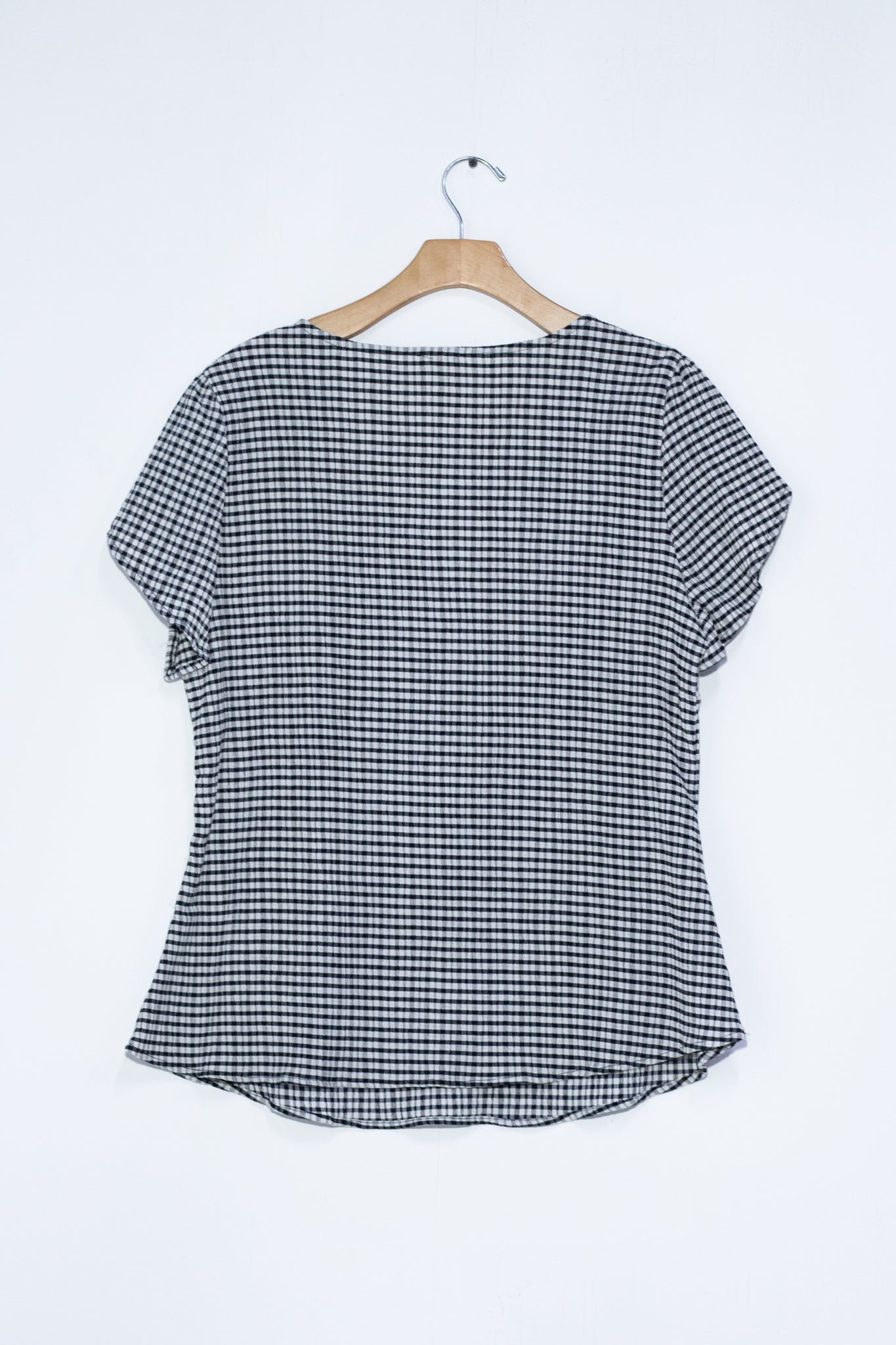 Blusa a cuadros rosa y negra