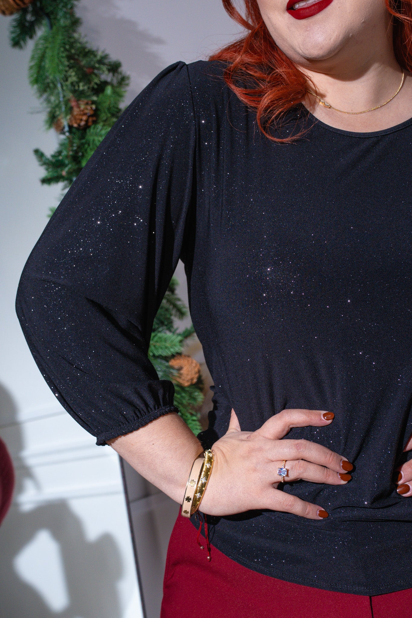 Blusa brillosa negra