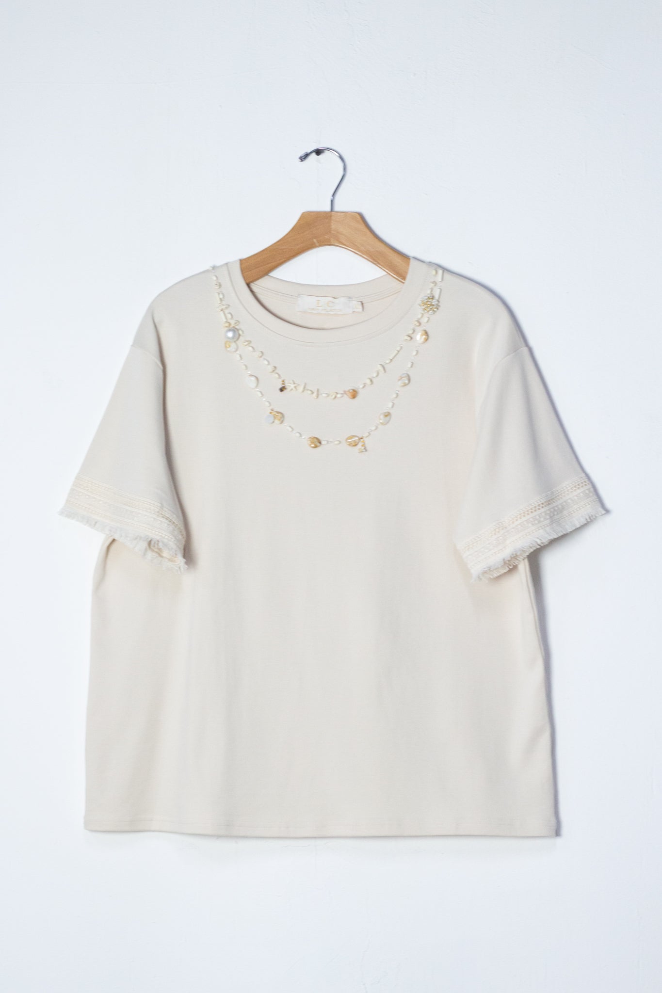 Blusa c/aplicaciones conchas bei